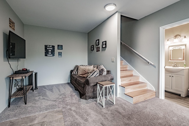 living room with sink and light colored carpet