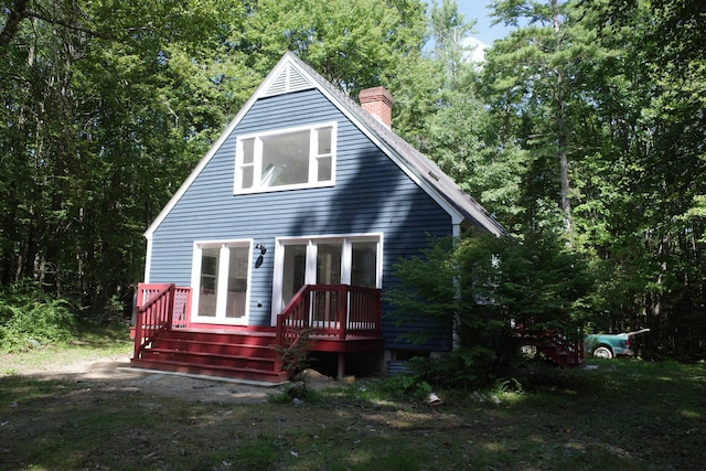 back of property featuring a deck