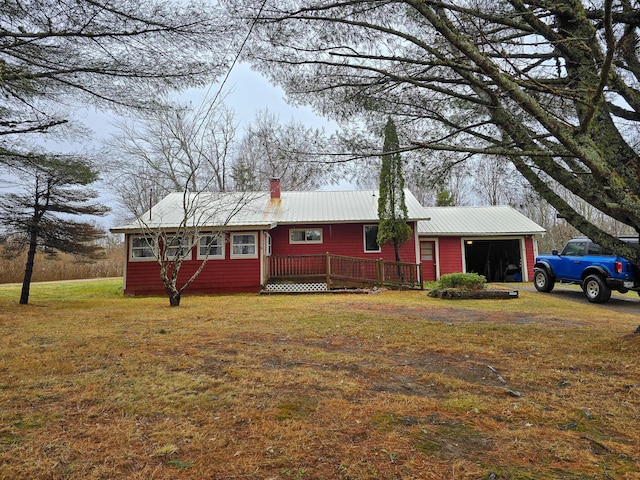 single story home featuring a front lawn and a deck