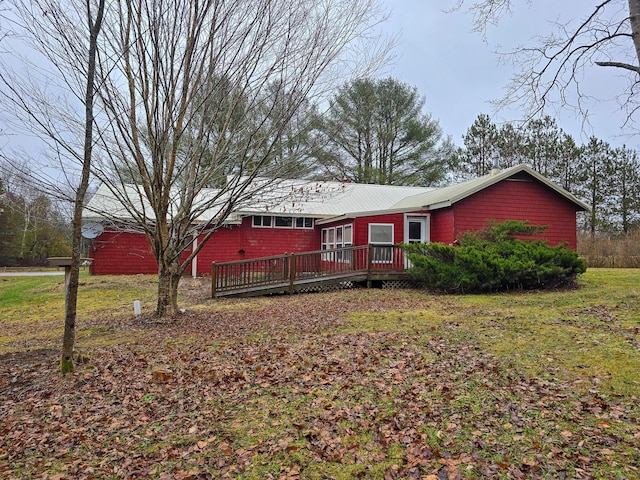 back of house featuring a wooden deck