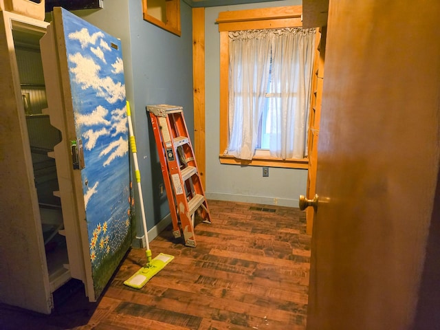 interior space with dark hardwood / wood-style flooring