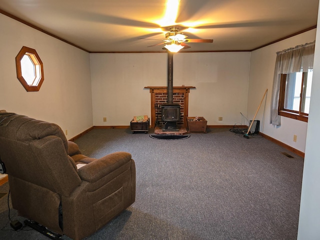 carpeted living room featuring a wood stove, crown molding, and plenty of natural light