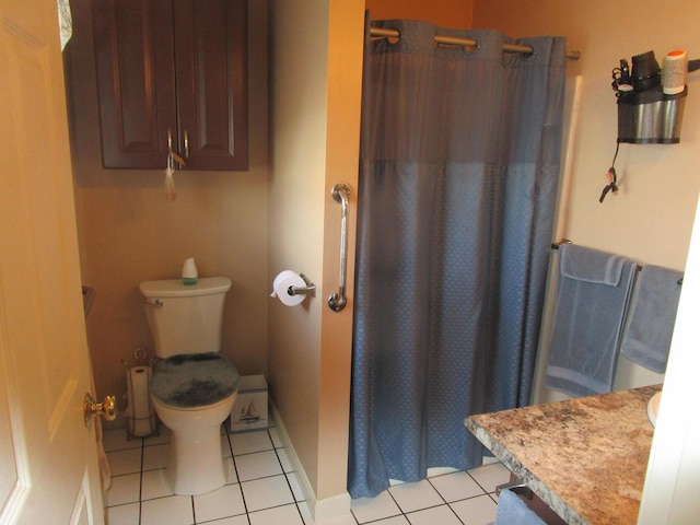 bathroom with tile patterned flooring, a shower with curtain, toilet, and vanity