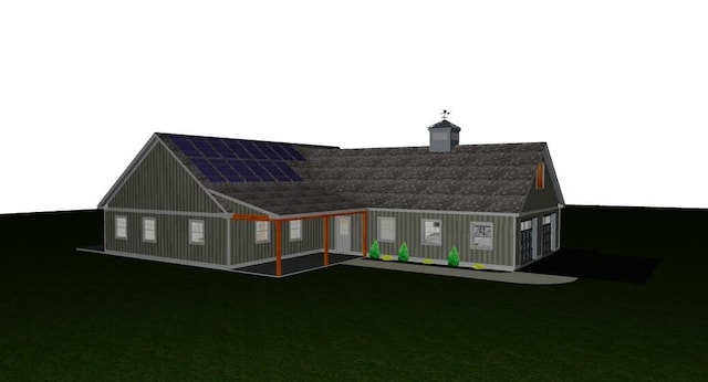 back of house with solar panels