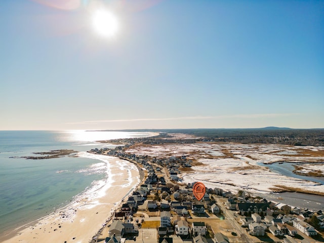 birds eye view of property featuring a view of the beach and a water view