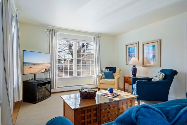 living area with a baseboard heating unit