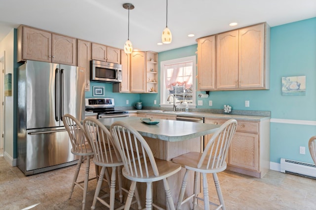 kitchen with stainless steel appliances, a baseboard heating unit, a kitchen island, and light brown cabinets