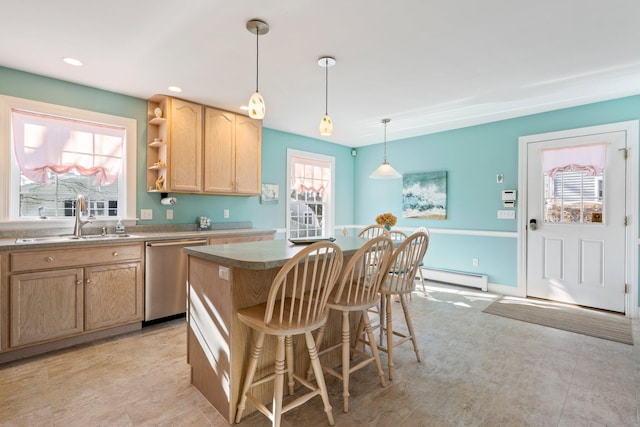 kitchen with plenty of natural light, a center island, dishwasher, and sink