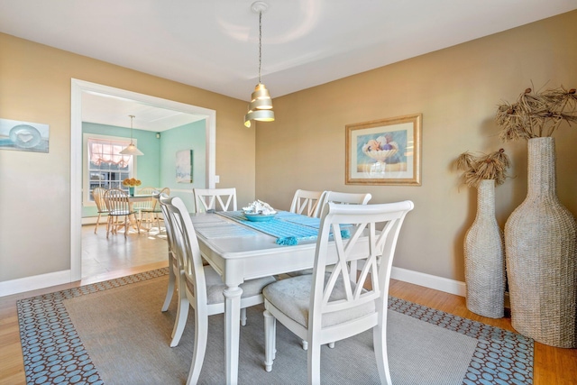 dining area featuring light wood-type flooring