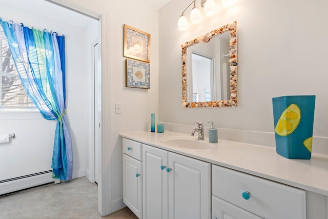 bathroom with baseboard heating and vanity