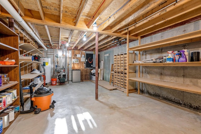 basement with water heater and stainless steel fridge