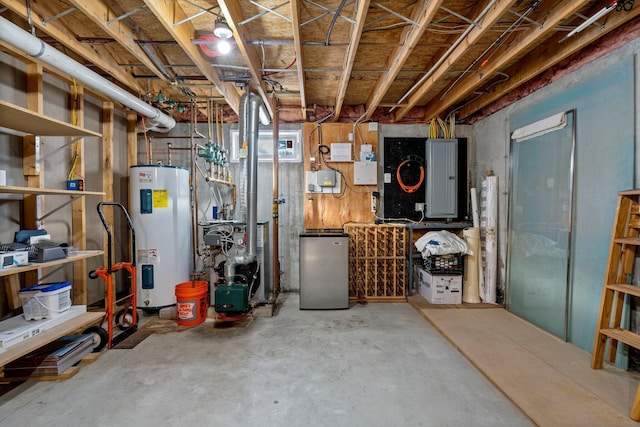 basement featuring water heater, electric panel, and stainless steel fridge