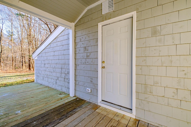 entrance to property featuring a deck