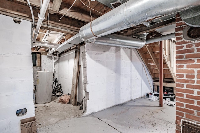 basement featuring brick wall