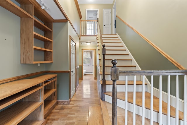 stairs featuring wood-type flooring