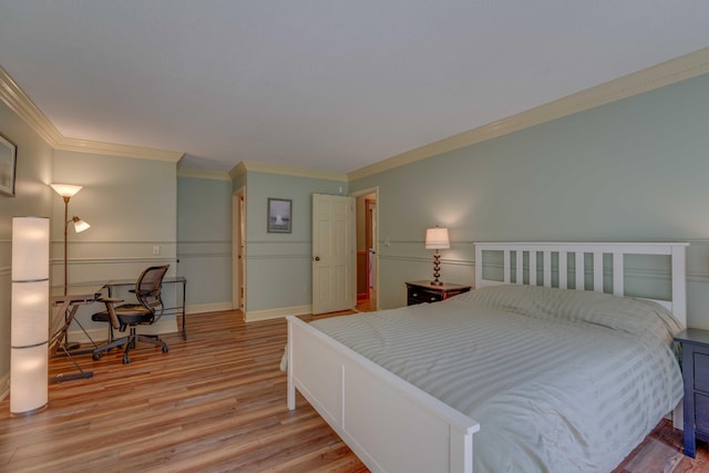 bedroom with light wood-type flooring and ornamental molding