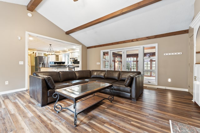 living room with vaulted ceiling with beams, french doors, and hardwood / wood-style flooring