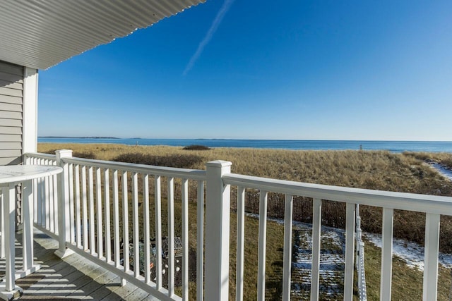 balcony featuring a water view