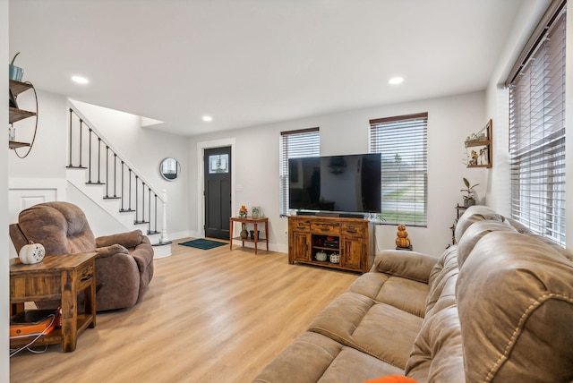 living room with light hardwood / wood-style flooring