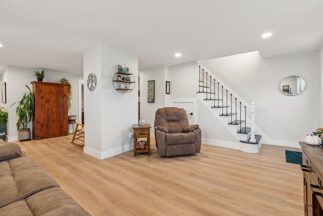 living room with light hardwood / wood-style flooring