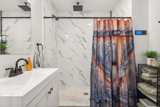 bathroom with curtained shower and vanity