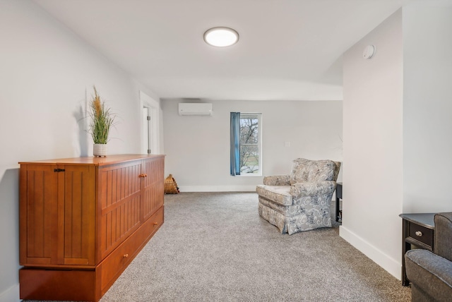 sitting room with carpet floors and an AC wall unit