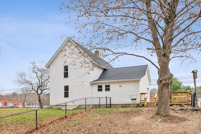 rear view of property featuring a deck