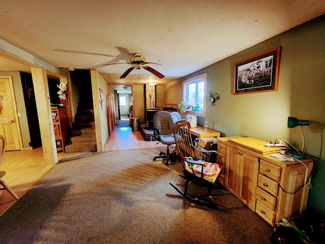 office with ceiling fan and light hardwood / wood-style flooring