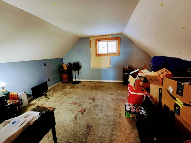 bonus room featuring carpet floors and lofted ceiling