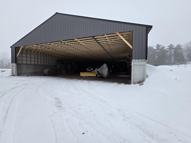 view of snow covered parking area