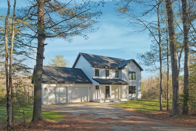 view of front facade featuring a front yard and a garage