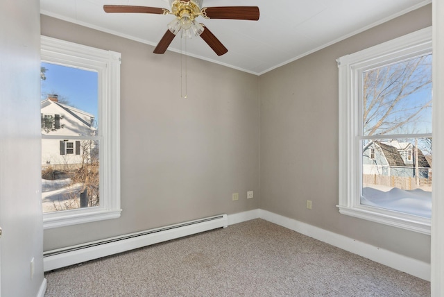 spare room featuring ornamental molding, carpet, baseboards, and a baseboard radiator