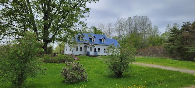 rear view of house with a yard