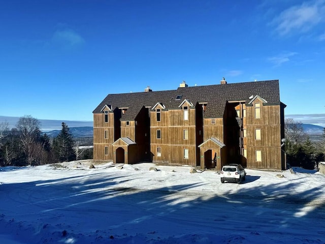 17-3 S Branch Way Unit 35, Sandy River Plt, ME 04970 - view of front facade featuring a chimney and a shingled roof