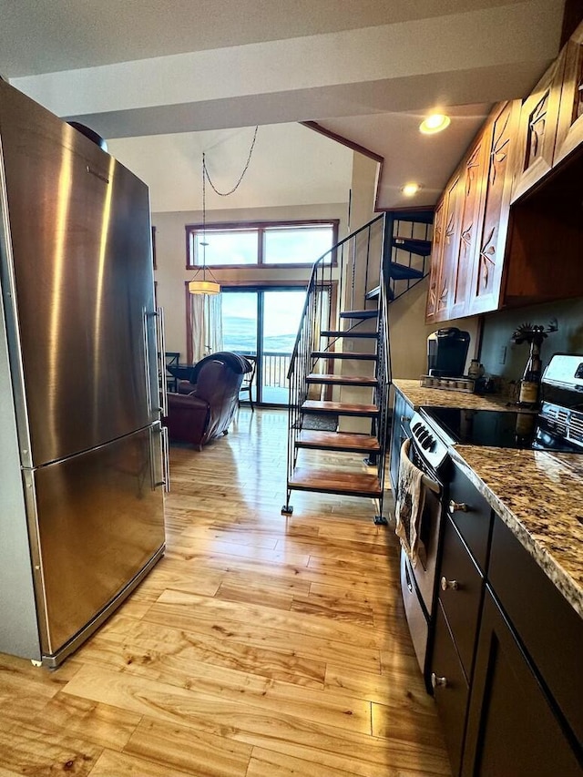 17-3 S Branch Way Unit 35, Sandy River Plt, ME 04970 - kitchen with appliances with stainless steel finishes, light wood finished floors, pendant lighting, dark stone countertops, and recessed lighting