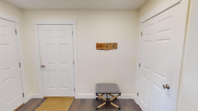 doorway to outside with dark hardwood / wood-style flooring