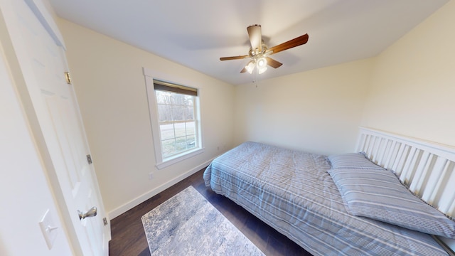 bedroom with ceiling fan and dark hardwood / wood-style flooring