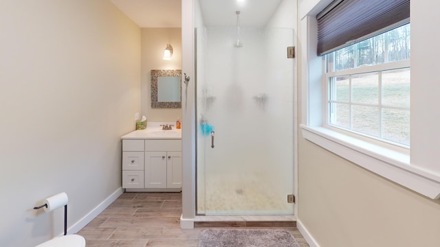 bathroom featuring vanity and an enclosed shower