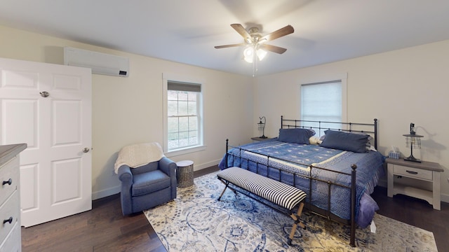 bedroom with dark hardwood / wood-style flooring, an AC wall unit, and ceiling fan