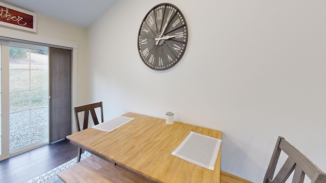 dining space with dark wood-type flooring