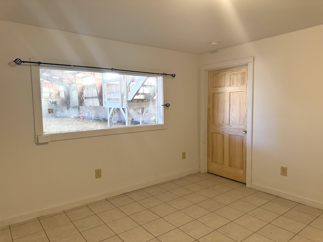 empty room featuring baseboards