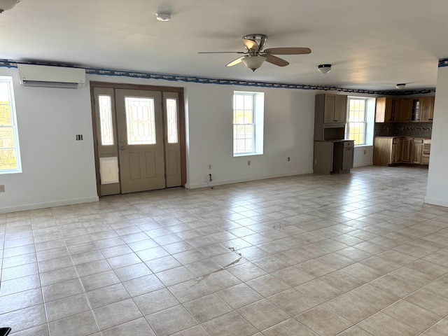 foyer featuring a wall mounted air conditioner, ceiling fan, and light tile patterned floors