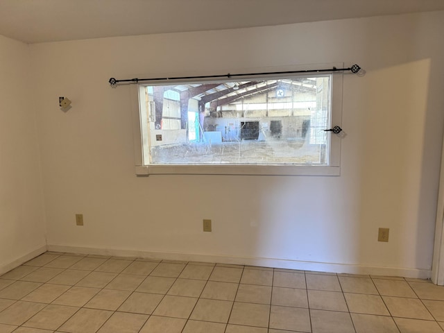 empty room featuring light tile patterned floors