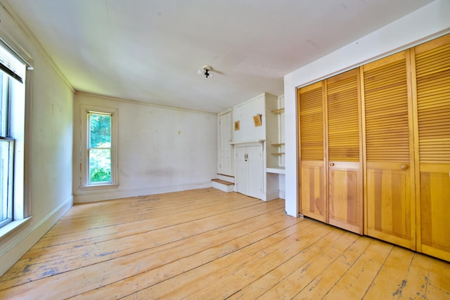 unfurnished living room with light wood-type flooring