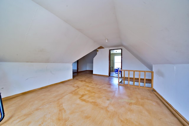 bonus room featuring vaulted ceiling