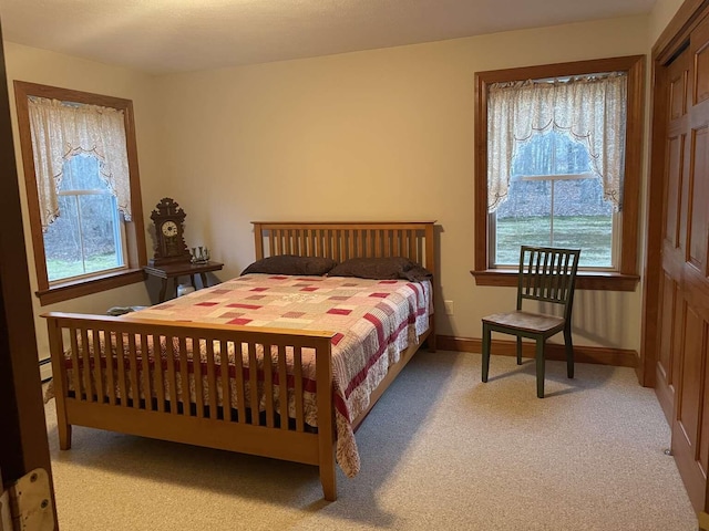 bedroom with light colored carpet