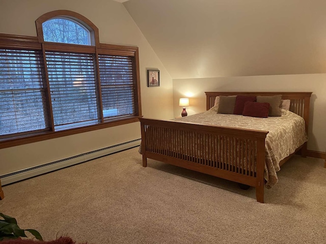 carpeted bedroom featuring vaulted ceiling and baseboard heating