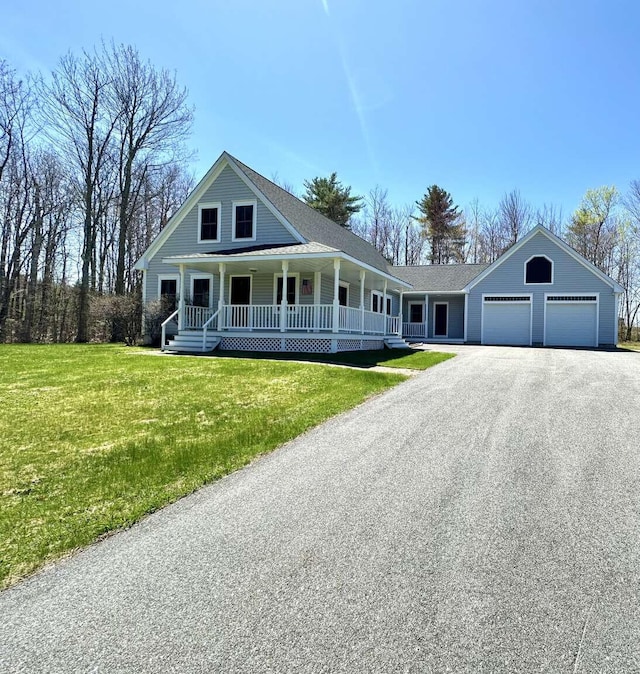 281 Danville Corner Rd, Auburn, ME 04210 - farmhouse with a porch, a garage, a front lawn, and aphalt driveway