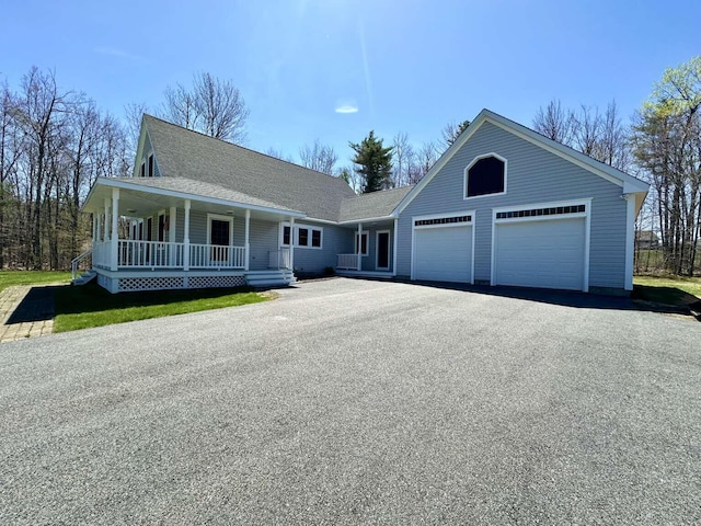 281 Danville Corner Rd, Auburn, ME 04210 - view of front of house featuring a porch, a shingled roof, an attached garage, and driveway