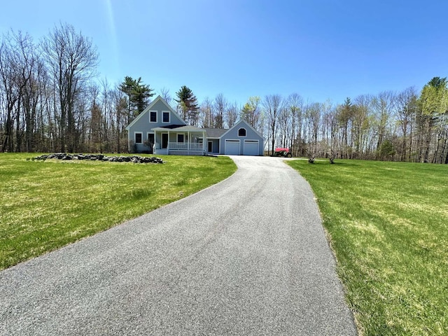 281 Danville Corner Rd, Auburn, ME 04210 - view of front of property with a garage, a porch, a front lawn, and aphalt driveway